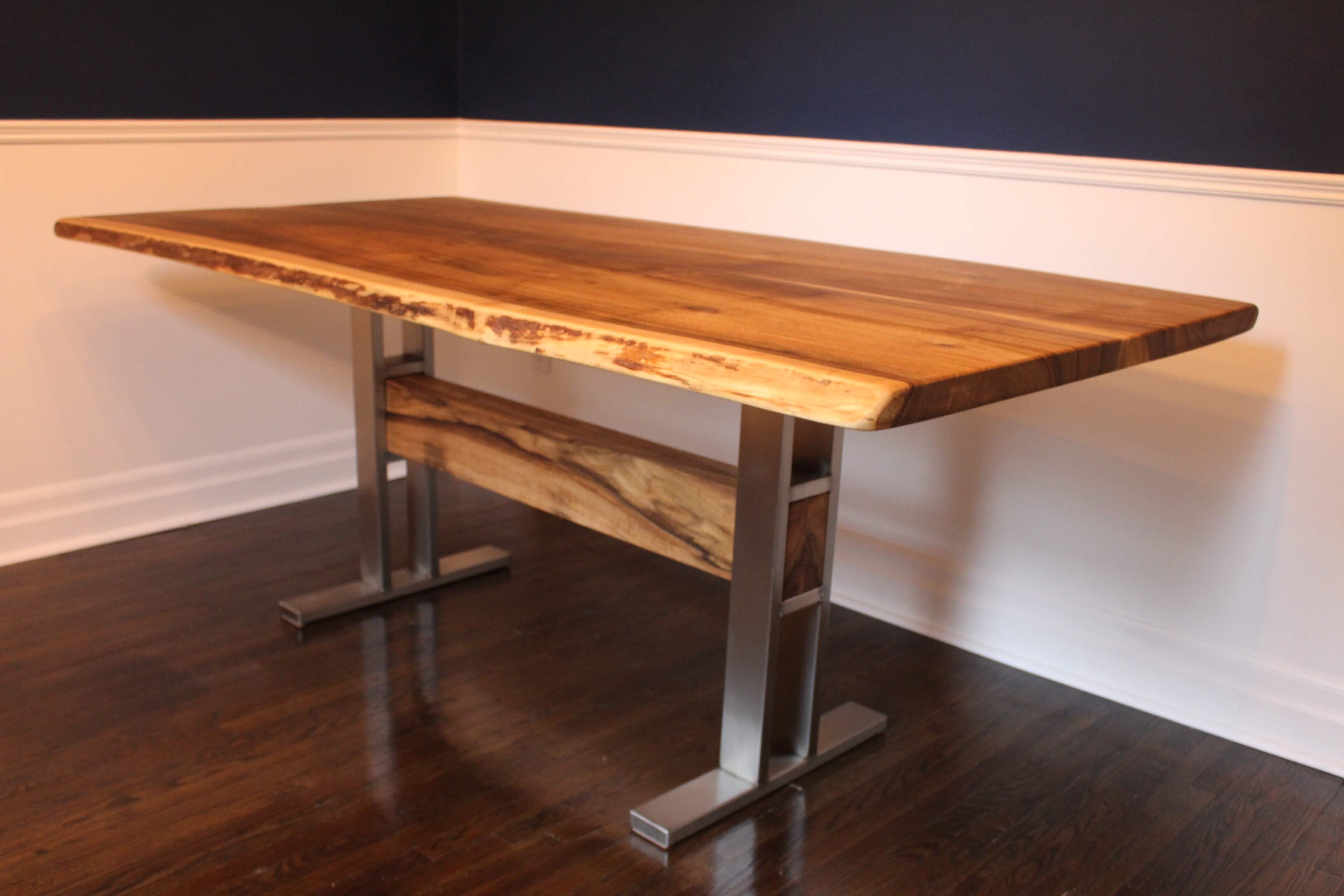 live edge walnut table with stainless steel trestle base with wood beam, made in muskoka, ships to NYC and toronto